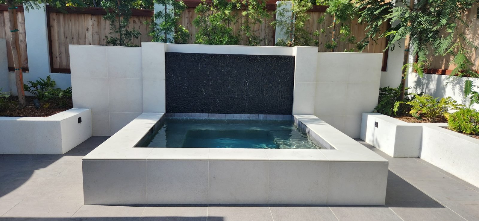 Boussebaa Residence, Del Mar — Raised spa with a dark mosaic finish