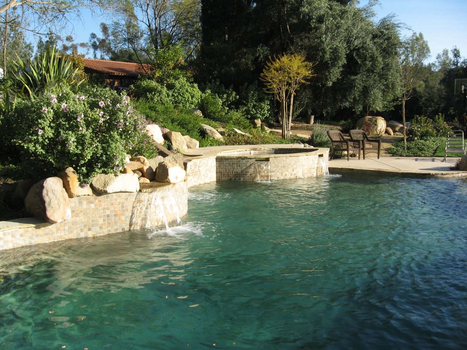Fiske Residence — Freeform pool and spa with a boulder waterfall