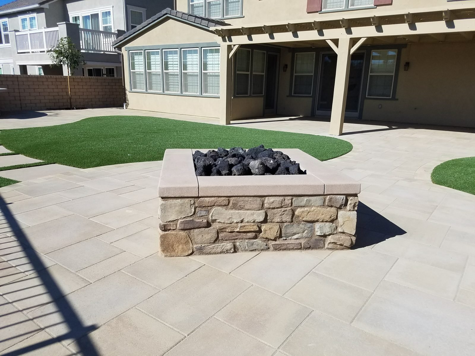 Matej Residence — Fire pit, pavers, and turf for everyday use