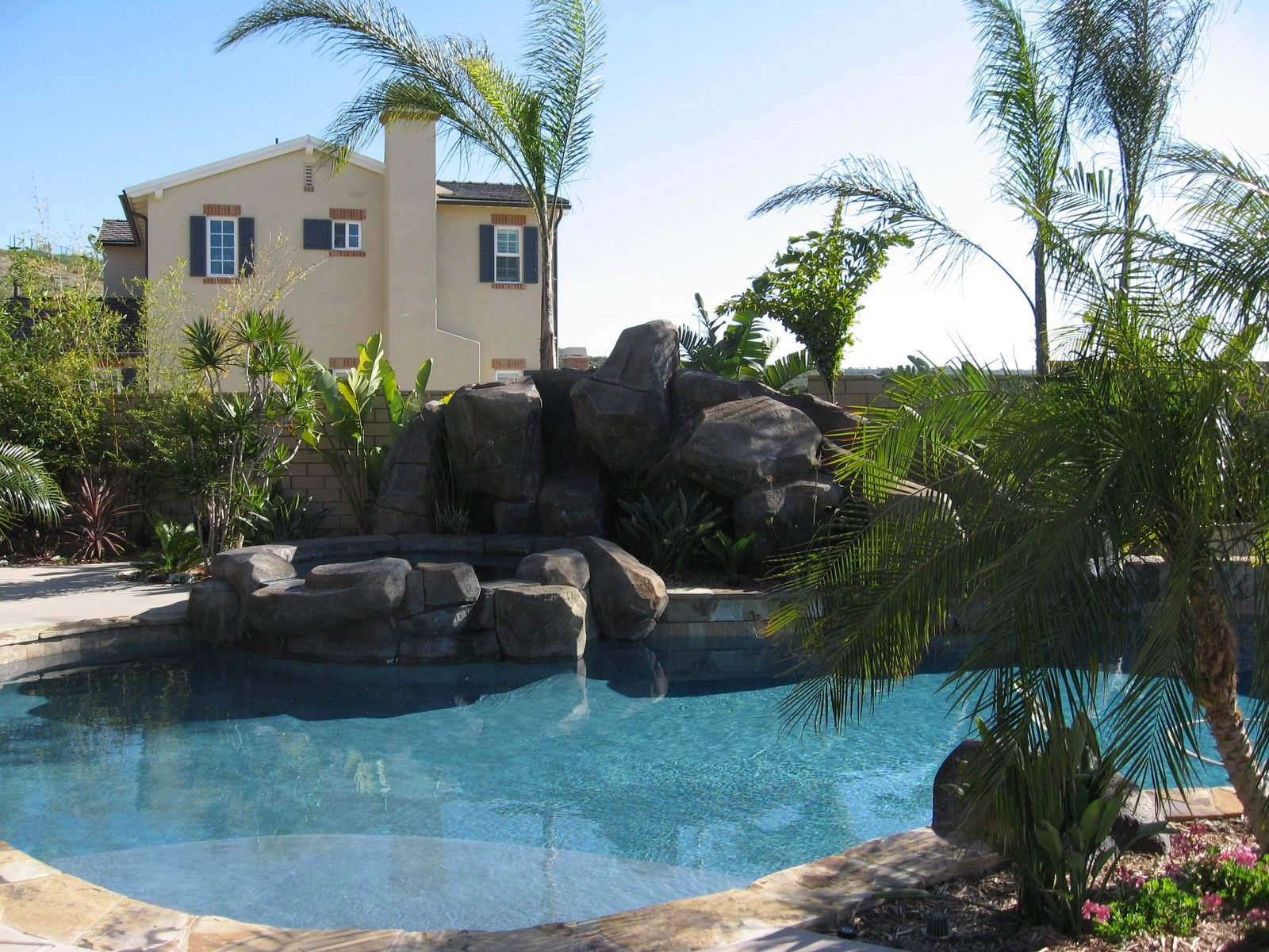 Quinn Residence — Lagoon-style pool with a boulder grotto