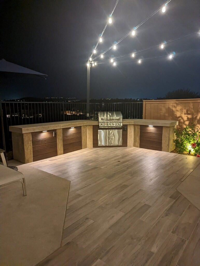 Roberts Residence — Outdoor kitchen and bar with a stone front